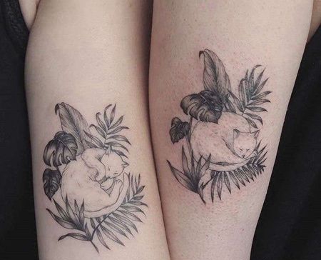 大臂猫叶子纹身图案