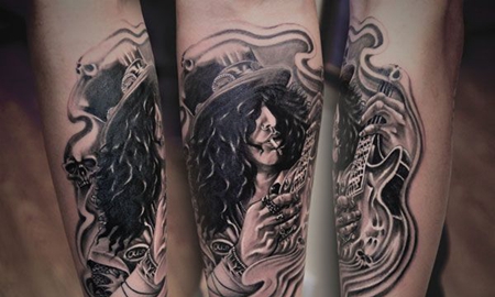 手臂弹吉他的恶魔纹身图案