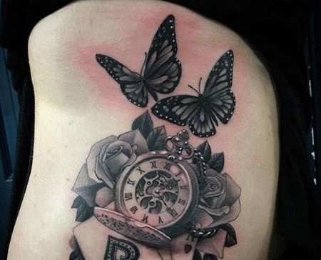 写实侧腰玫瑰蝴蝶钟表扑克纹身图案