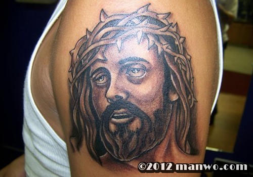 手臂上一款个性的耶稣头像纹身