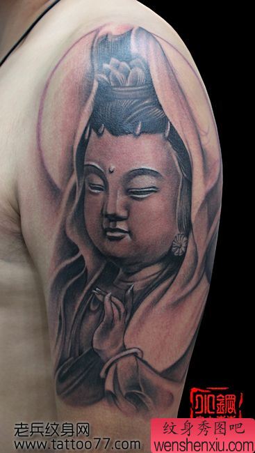 一幅手臂笑脸观音纹身图案