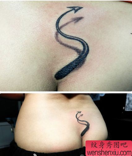 女孩子腰部一幅恶魔尾巴纹身图案