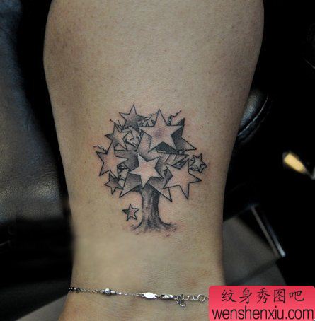 腿部另类流行的一幅五角星小树纹身图案