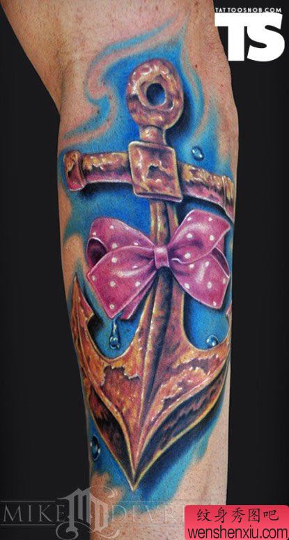 手部一幅创意蝴蝶结船锚文身作品