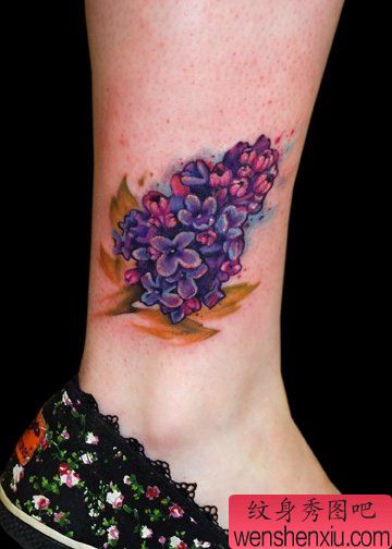 文身秀图吧推荐一幅腿部彩色花文身作品