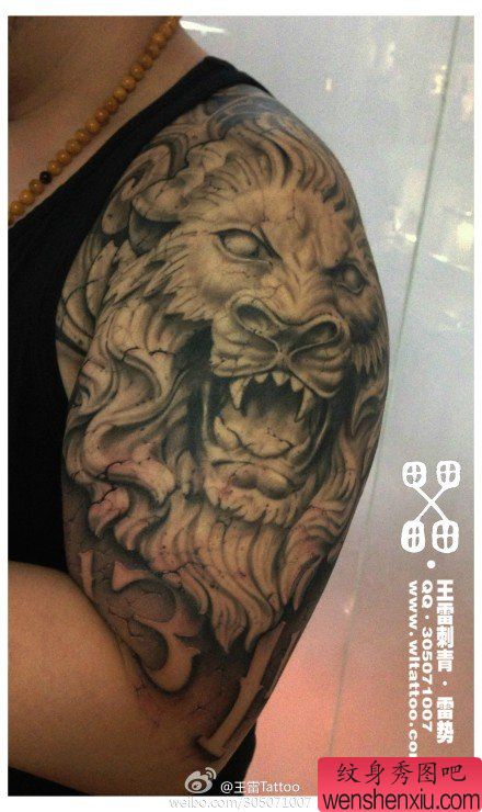 手臂超帅的石雕狮头纹身图案