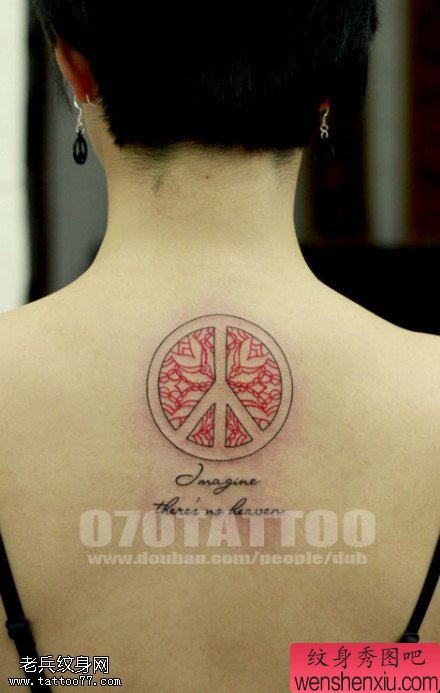 背部反战标志文身图片由文身秀图吧分享