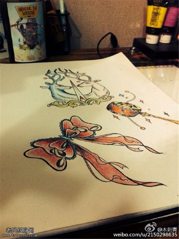 彩色蝴蝶结拨浪鼓纹身手稿图案