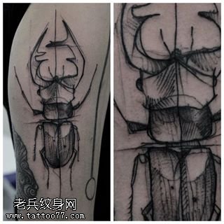 肩部点刺的老牛纹身图案