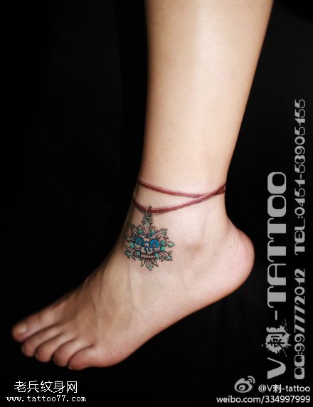 艳丽唯美骷髅头雪花纹身图案