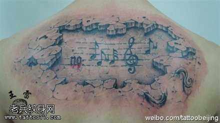 形象逼真石刻音符纹身图案