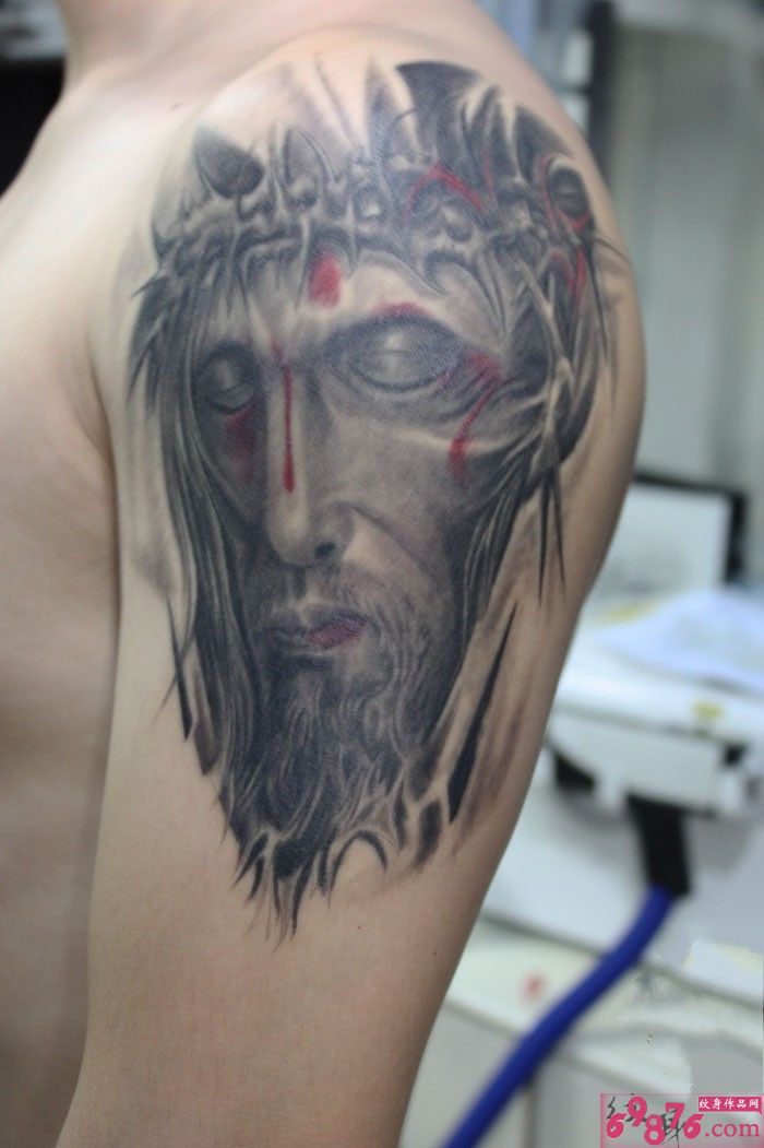 手臂耶稣头像纹身图案图片