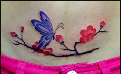 美女腹部梅花蝴蝶纹身图案图片