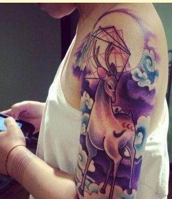 时尚女性手臂好看的彩色星空羚羊纹身图片