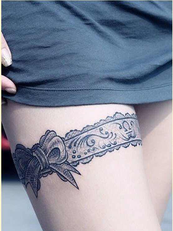 时尚女性腿部漂亮蕾丝蝴蝶结纹身图案图片