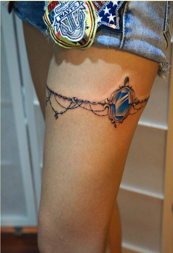 时尚女性腿部漂亮的腿链宝石纹身图案图片