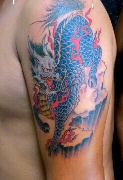 大臂火麒麟刺青