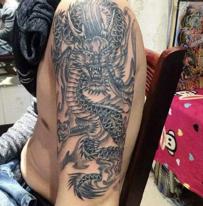 经典炫酷的大臂麒麟刺青