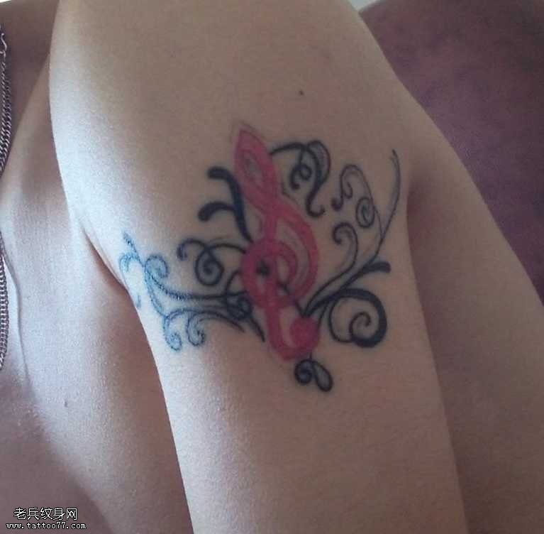 胳膊个性音符纹身图案