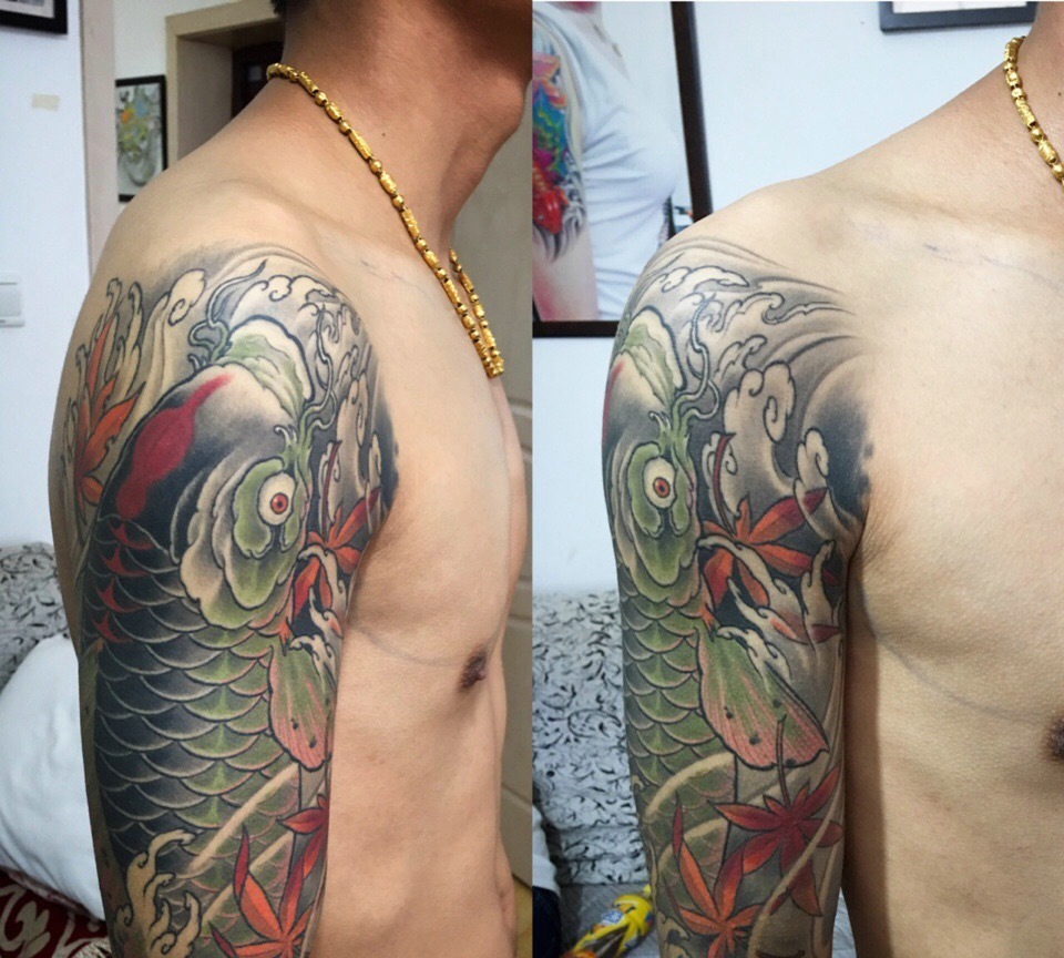 眼神明亮的大臂传统鲤鱼纹身图案