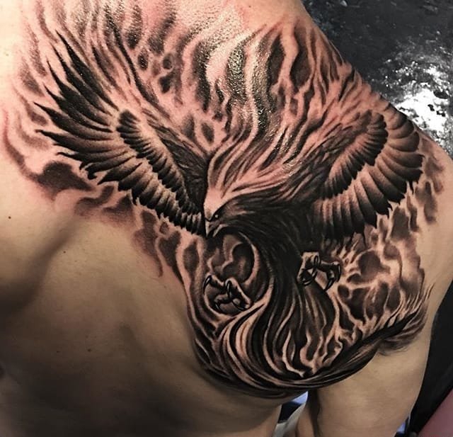 大腿上一把很真实的枪纹身图案