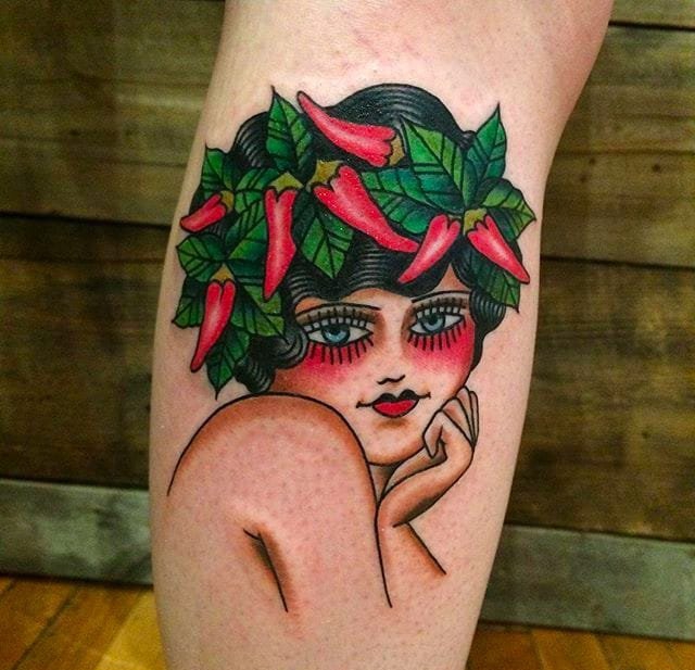 大腿上的女孩和恶魔面具纹身图案