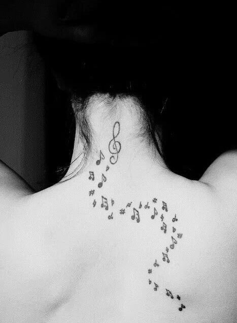 女孩身上美妙的音符纹身图案