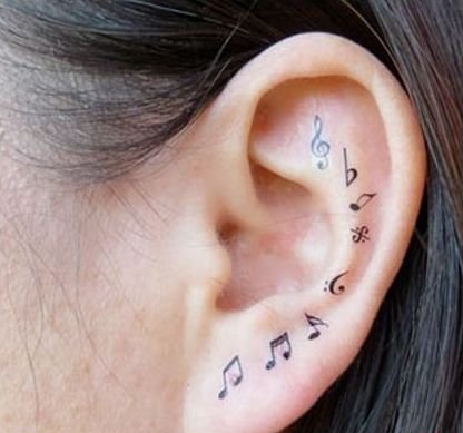 女孩身上美妙的音符纹身图案