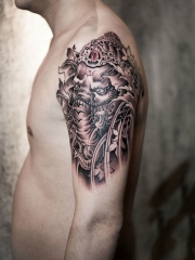 手臂目光如炬的象神纹身图案