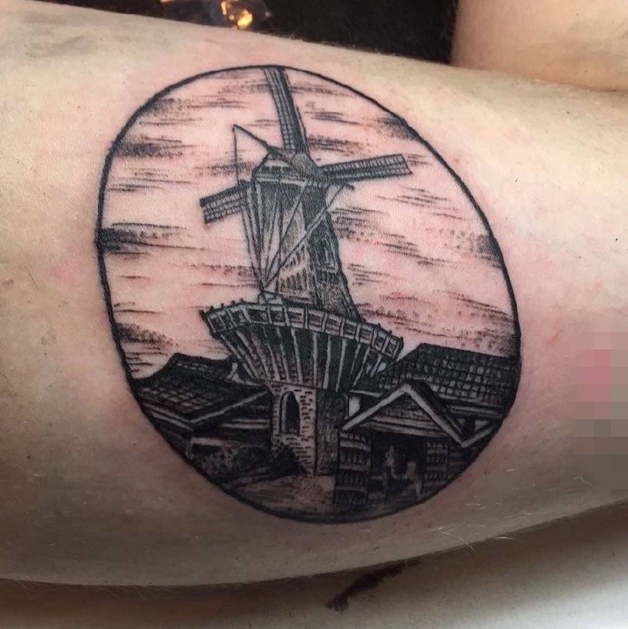 女生小腿上黑色素描点刺技巧建筑风车纹身图片