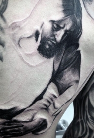 背部宗教风格的黑灰纹身图案