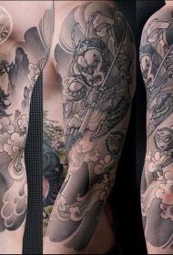 手臂黑色斗战胜佛与寺庙纹身图案