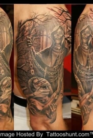 大臂黑灰恶魔与墓地纹身图案