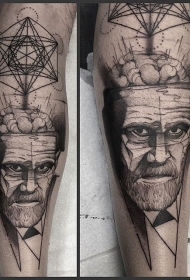 小腿黑色多种符号与男人肖像纹身图案