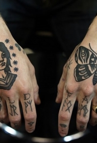 手背old school黑白肖像与字母蝴蝶纹身图案