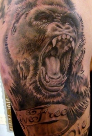 大臂黑灰字母和大猩猩头像纹身图案