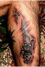 腿部棕色皮肤撕裂眼睛纹身图片