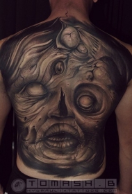 背部黑色神秘的怪物脸纹身图案
