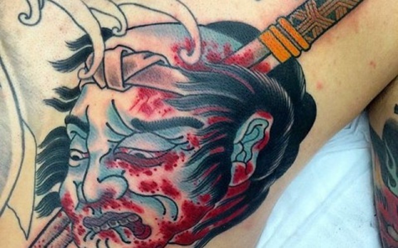 亚洲传统彩色血腥的生首纹身图案