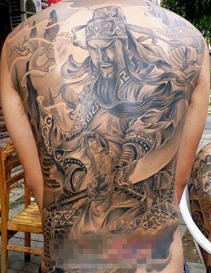 勇猛威武的黑色点刺抽象线条人物肖像关公纹身图案