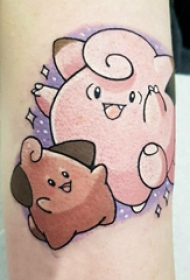 手臂纹身图片 女生手臂上彩色的卡通纹身图片