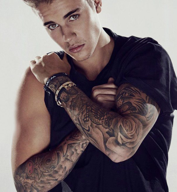 贾斯丁比伯纹身  明星手臂上花朵和动物纹身图片