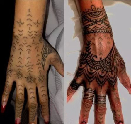 蕾哈娜手上纹身   蕾哈娜手上黑色的部落图腾纹身图片