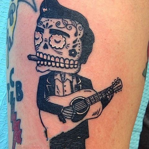 音乐纹身图案   创意表达的乐器纹身图案