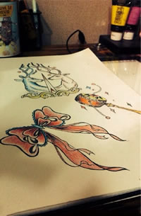 彩色蝴蝶结拨浪鼓纹身手稿图案