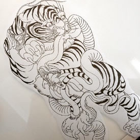 手稿蛇戏老虎纹身图案