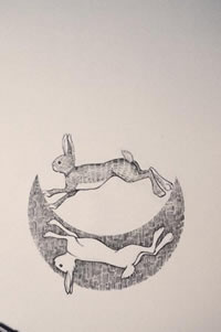 月亮上的两只兔子纹身图案