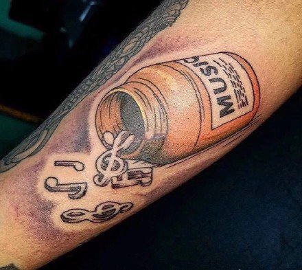 一组和音乐相关的音符乐器等纹身图案欣赏