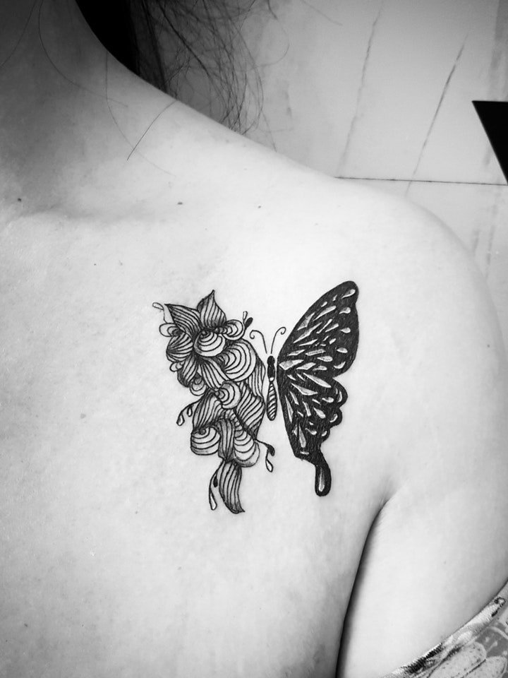 蝴蝶纹身图片  景色里翩翩起舞的蝴蝶纹身图案