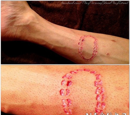 手臂恐怖割肉艺术纹身图案